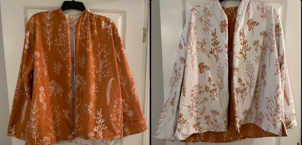 Handmand reversible jacket, one side orange with white flowers, the other side white with orange flowers