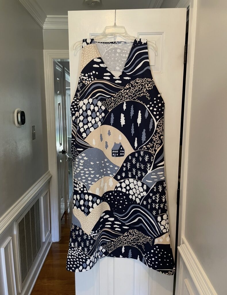 Handmade dress with blue, white and beige pattern 